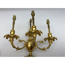 Set of four 19th century and later ormolu wall sconces, each modelled as an Atlas figure stood upon a curved bracket with acanthus support, supporting a plain globe with three scrolling branches with beaded sockets above foliate drip pans, and further conforming socket and drip pan, H67cm