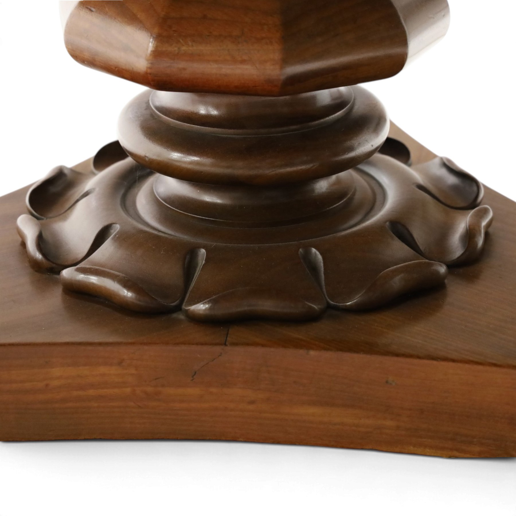 William IV mahogany circular breakfast table, banded frieze over a turned decagon pedestal with lappet carved collar, terminating to a triform platform base with scroll feet and castors