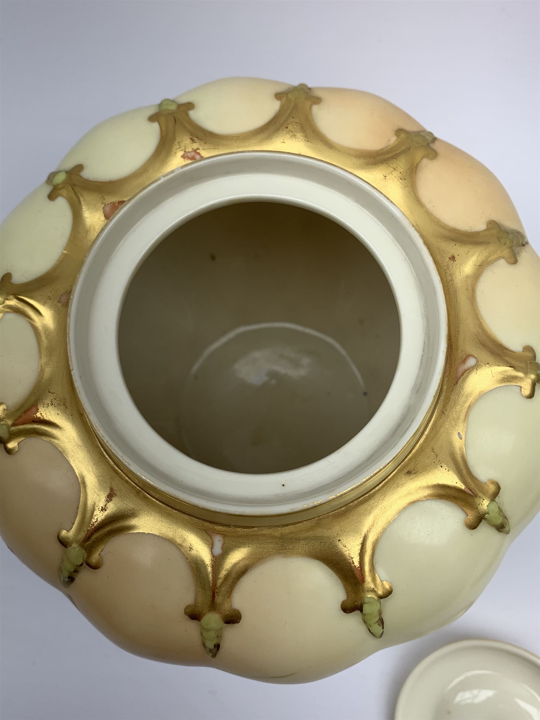 A Royal Worcester blush ivory potpourri jar and cover, of lobed form decorated with floral sprays and heightened with gilt, with printed marks beneath, RdNo112589, shape 1312, overall H19.5cm.