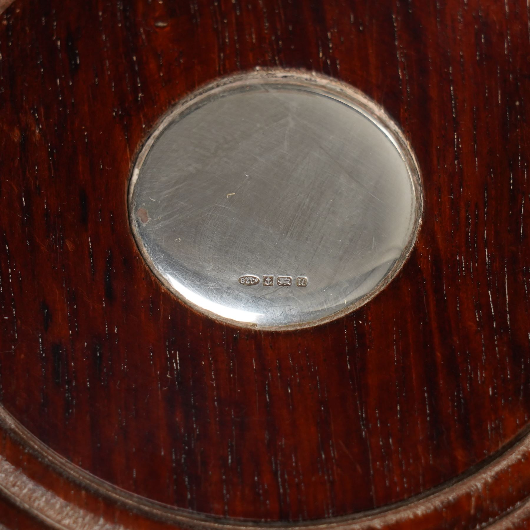 Pair of Elizabeth II silver bottle coasters with turned wooden bases D12cm, Birmingham 1994 Maker W I Broadway & Co.