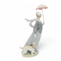 Lladro figure, Lady with Shawl, modeled as a woman holding a parasol with an afghan hound, model no 4914, H46cm 
