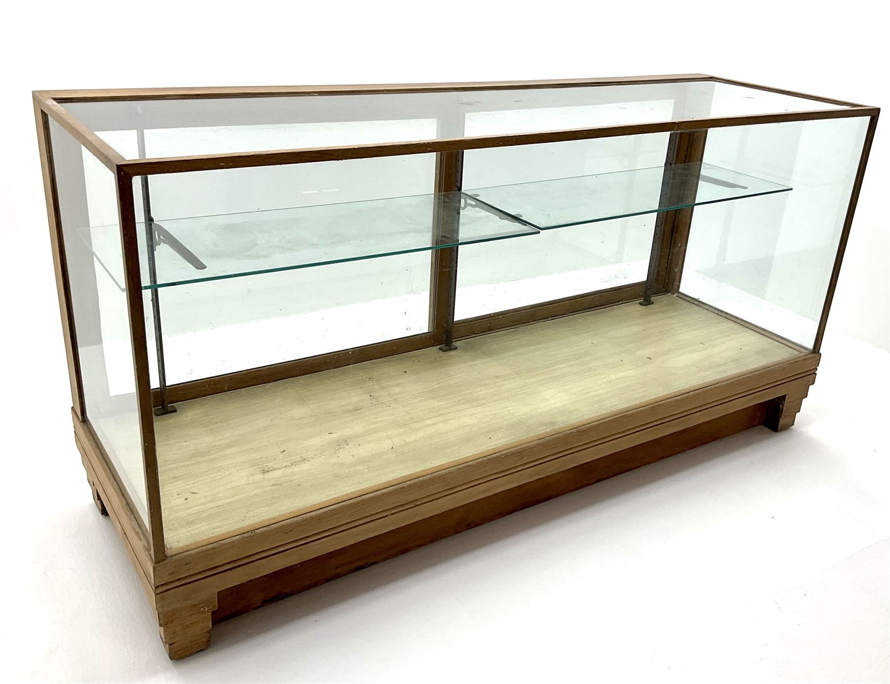 Mid century oak framed glazed display counter, two sliding doors, glazed shelves W182cm, H91cm, D61cm