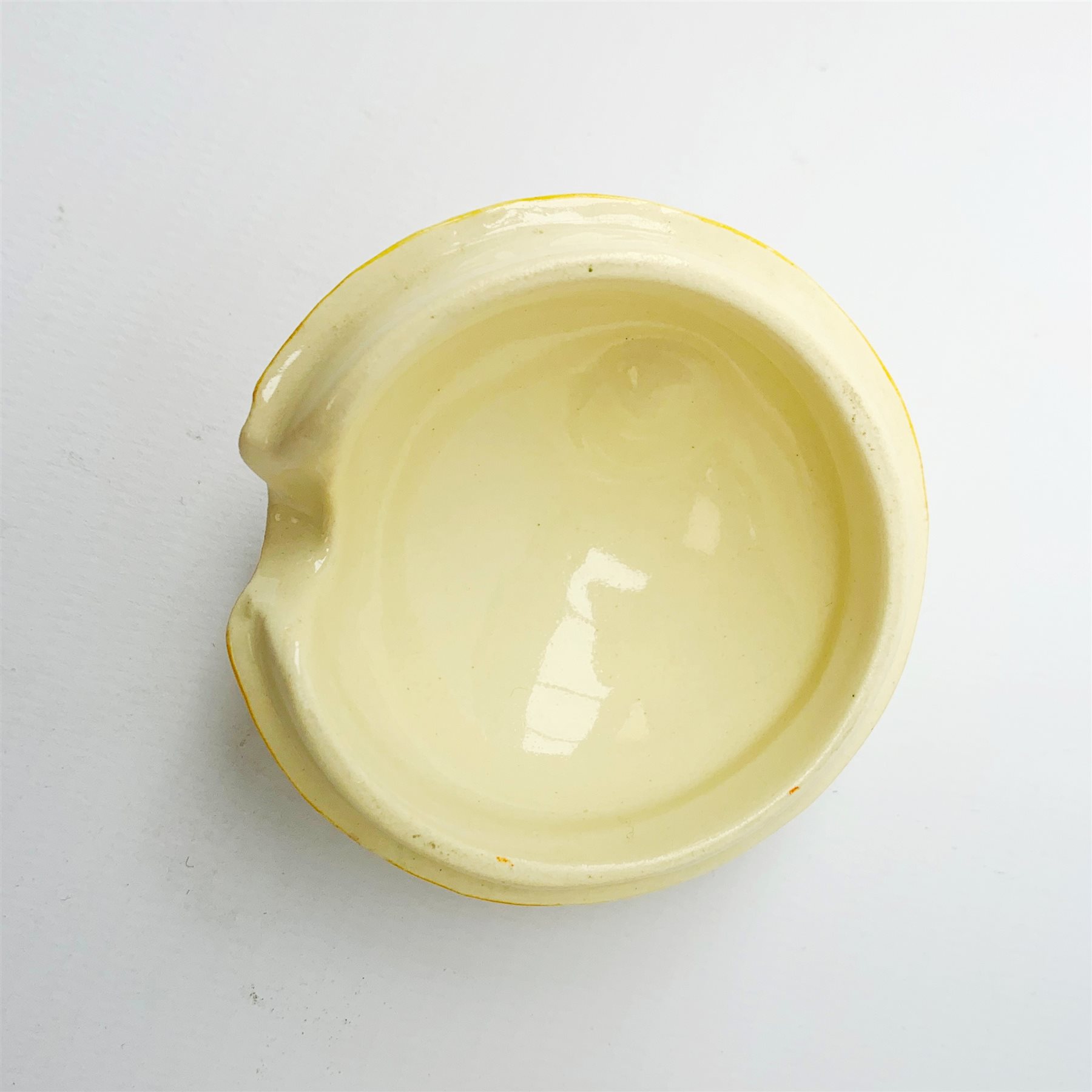 A Clarice Cliff Newport Pottery honey pot, modelled in the form of a beehive and decorated in the Crocus pattern, H10cm.