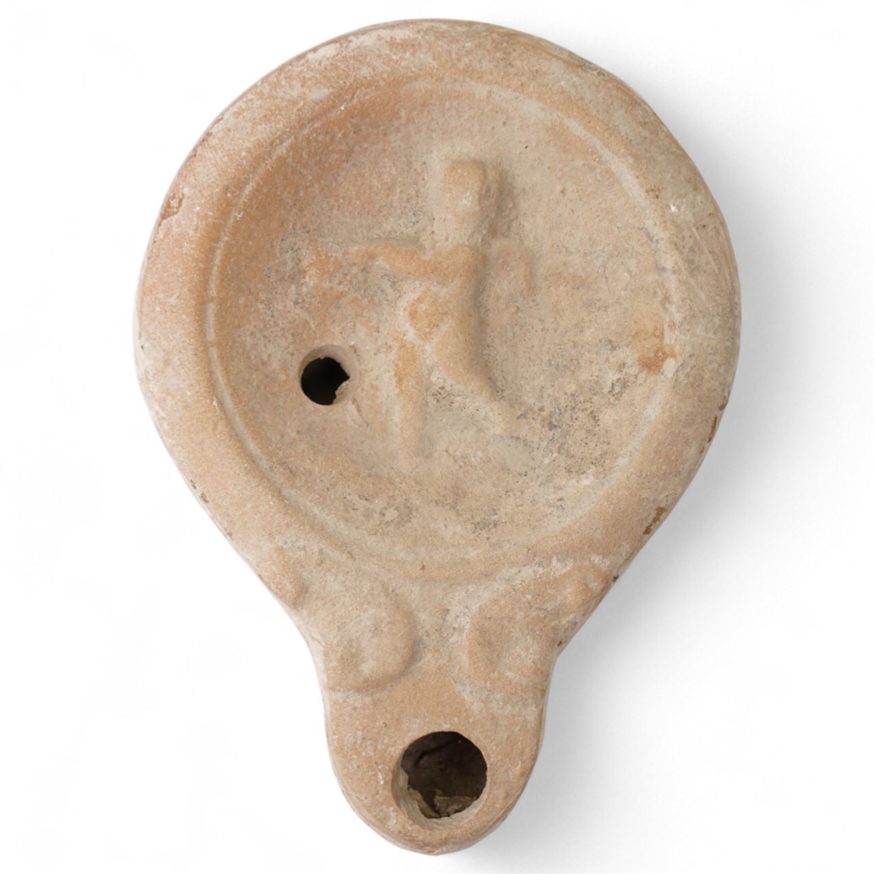 Roman terracotta oil lamp with Cupid motif c.1st-2nd Century AD, mould-made, with a rounded body and volute nozzle, the concave discus decorated in relief with a figure of Cupid in motion, depicted with wings and bow, within a raised circular border, with central fill-hole and wick-hole at the nozzle W 8.5cm
Provenance: By the vendor’s repute, acquired/collected in the Middle East (Dead Sea area/Syria) in the 1960s