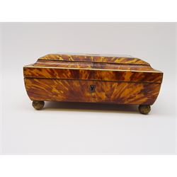 19th century tortoiseshell sewing box, of sarcophagal form upon four foliate detailed brass ball feet, the hinged cover edged in ivory with initialled silver plaque to centre, opening to reveal a silk lined interior, H9.5cm W22.5cm D18cm