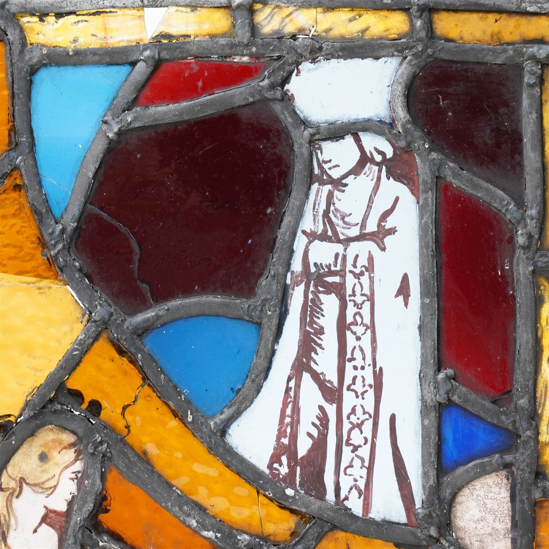 Arts & Crafts leaded stained glass panel depicting a painted seated siren or mermaid and a robed figure 31cm x 28cm