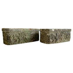 Pair of cast stone garden planters, canted rectangular form with moulded edge, decorated with lion mask flanked by extending acanthus leaf scrolls