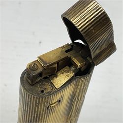 Collection of lighters, including Ronson Varaflame, Zorr Classic, Dunhill bark effect roller gas lighter, and faceted blue glass table lighter, etc