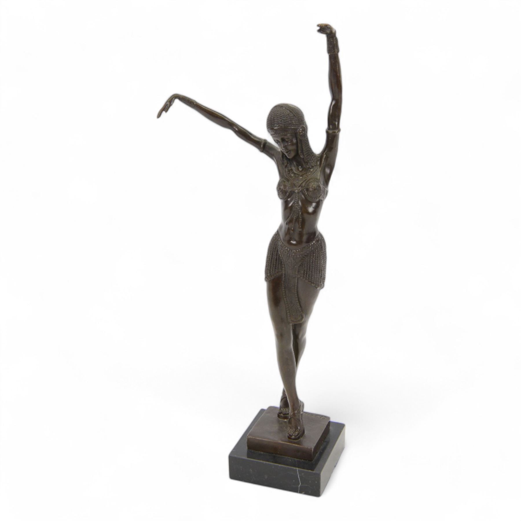 Art Deco style bronze figure of a female dancer after Demetre Chiparus, with signature to base, upon a black marble plinth, H49cm