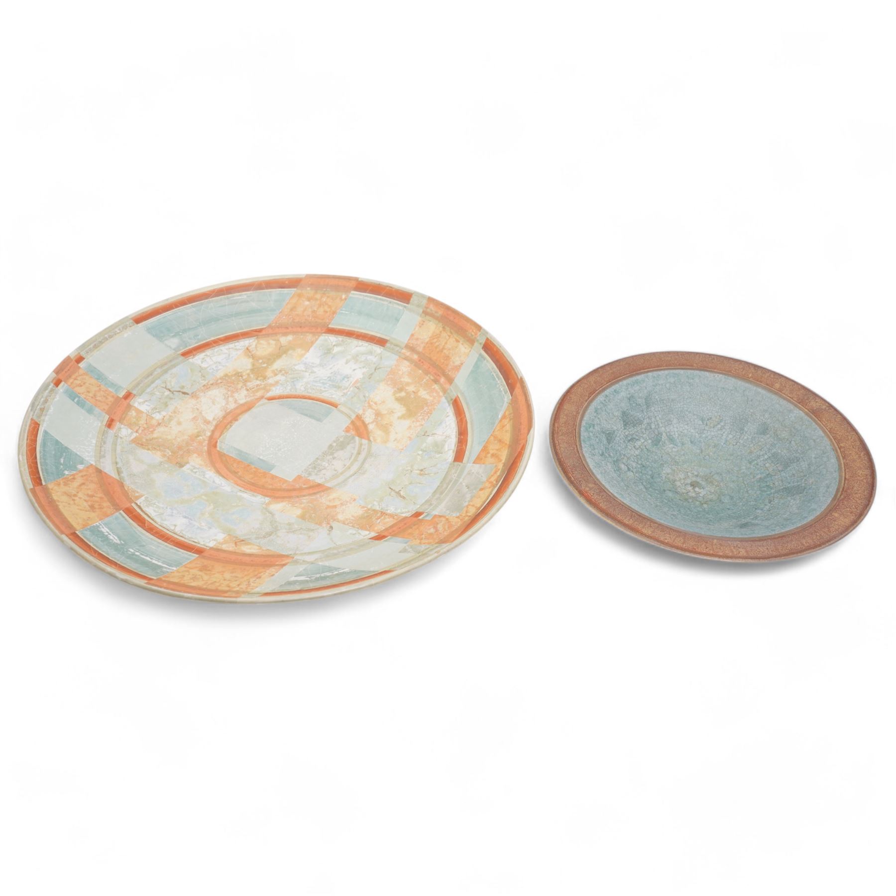 Tony Laverick (1961-); Charger painted with crossing horizontal and vertical lines of marbled blue and orange, the base signed with initials and dated '98, D42.5cm and a smaller bowl, signed with initials and dated '99, D26cm (2)