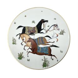 Hermès 'Cheval d'Orient' plate, decorated in the style of Persian miniatures with whimsical design of four leaping Arabian horses with colourful saddle pads and gilt, with Hermes marks beneath, D21cm