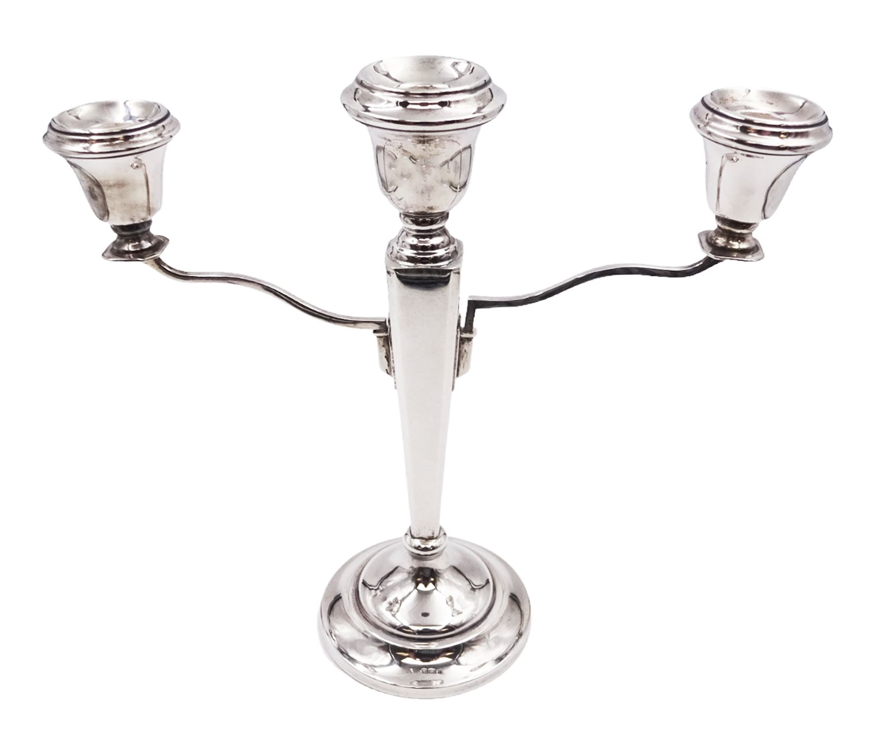 Modern silver mounted three branch candelabra, the tapering stem supporting a central candle holder and two removable curved branches with candle holders, upon spreading circular foot, hallmarked Birmingham 1968, maker's mark worn and indistinct, H25.5cm