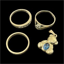 Three 9ct gold stone set rings and a 9ct gold stone set teddy bear charm/pendant 