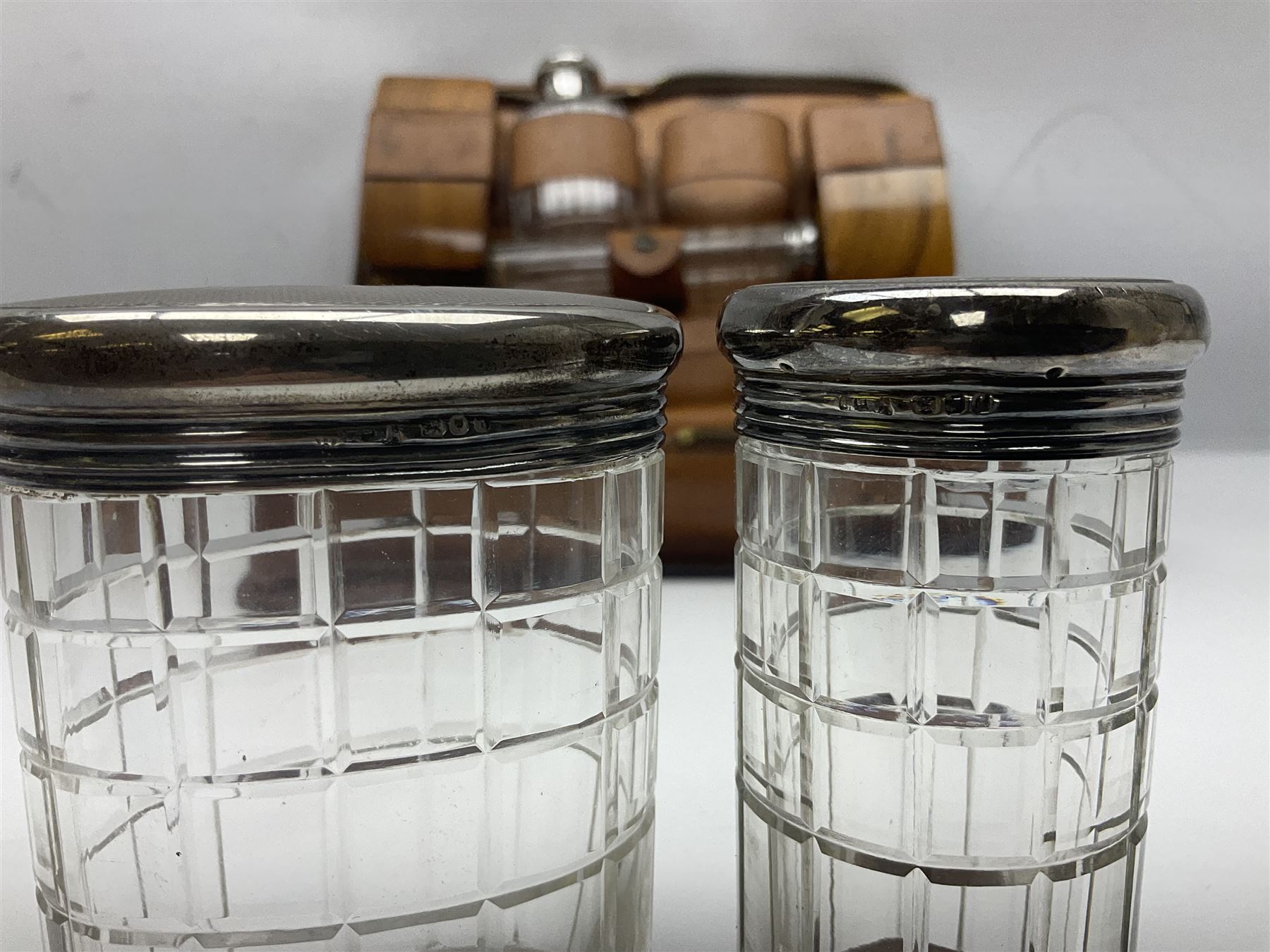 Mappin & Webb leather cased campaign gentleman's vanity set, the tan leather case opening to reveal fitted interior with five engine turned silver capped glass vanity bottles, hallmarked Mappin & Webb, London 1944, brushes, mirror etc, monogram DPK to the top of the case