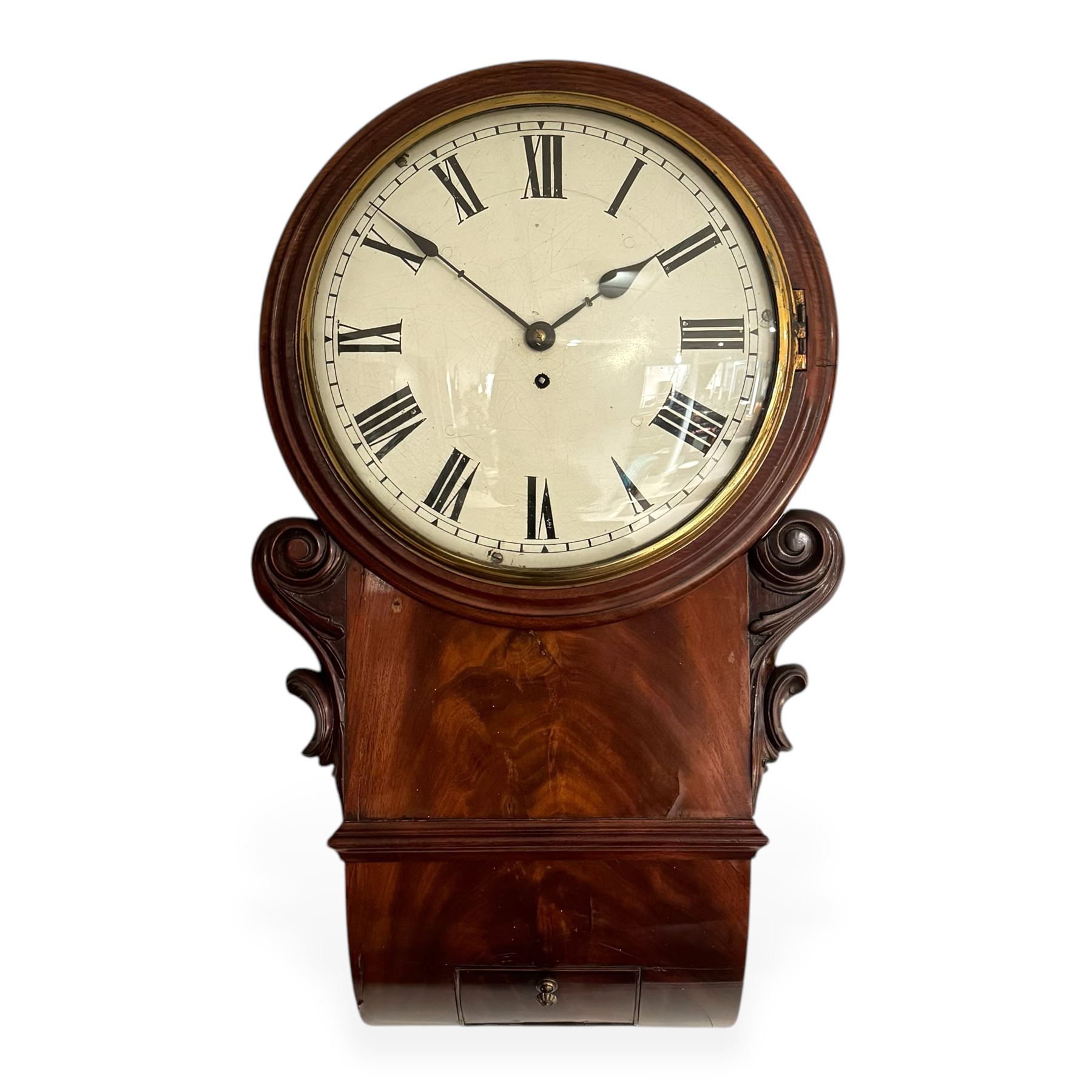 English-Late Victorian 8-day drop dial wall clock, with a mahogany case and moulded dial surround, scroll carved case ears and a curved base, pendulum regulation doors to the side and base, 12