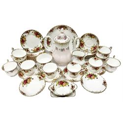 Royal Albert Old Country Roses pattern part tea service, comprising ten teacups, twelve saucers, twelve side plates, milk jug, open sucrier, cake plate and other dishes, together with Royal Albert coffee pot decorated with rose sprays above pale pink band