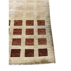 Contemporary camel ground woollen rug, decorated with gradient squares in shades of terracotta 