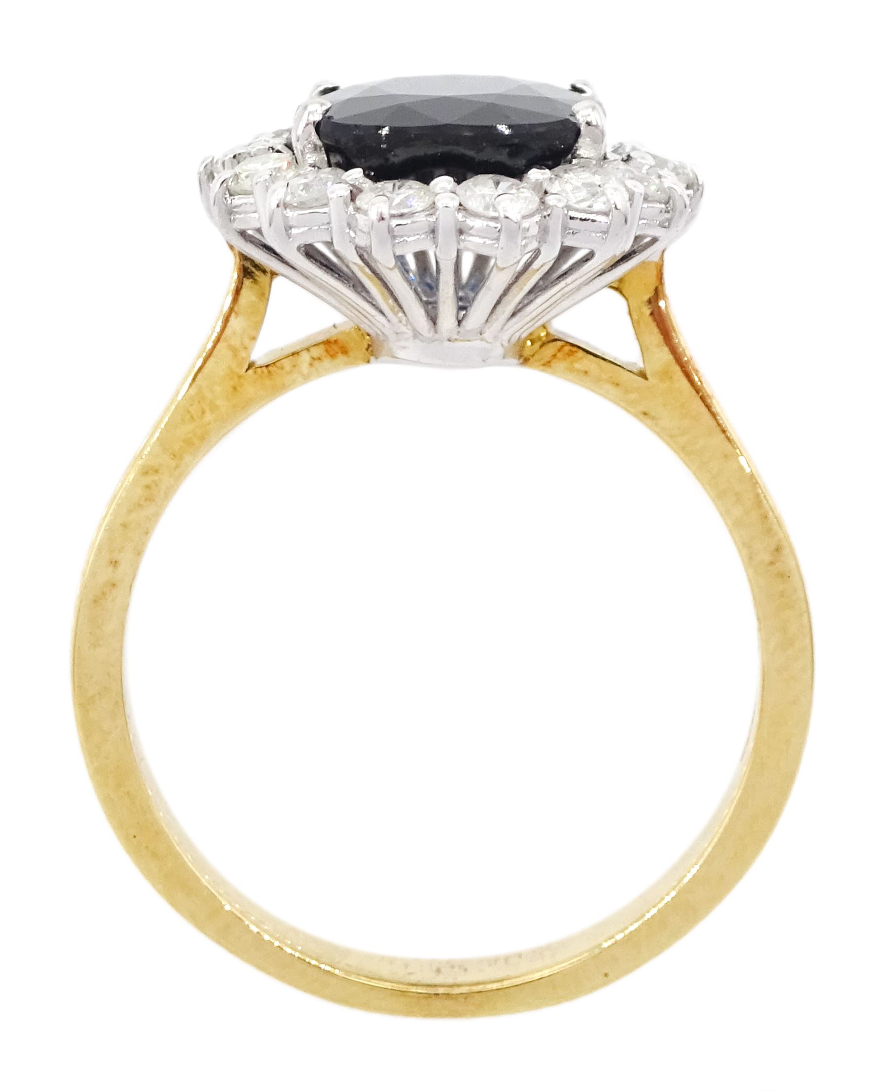 18ct gold oval cut sapphire and round brilliant cut diamond cluster ring, sapphire approx 3.30 carat, total diamond weight approx 0.85 carat