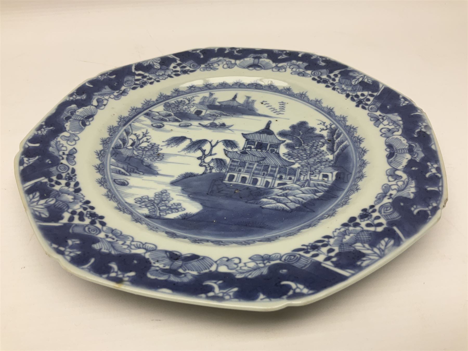 18th century Chinese export blue and white plate of octagonal form, with a pagoda landscape, D23cm