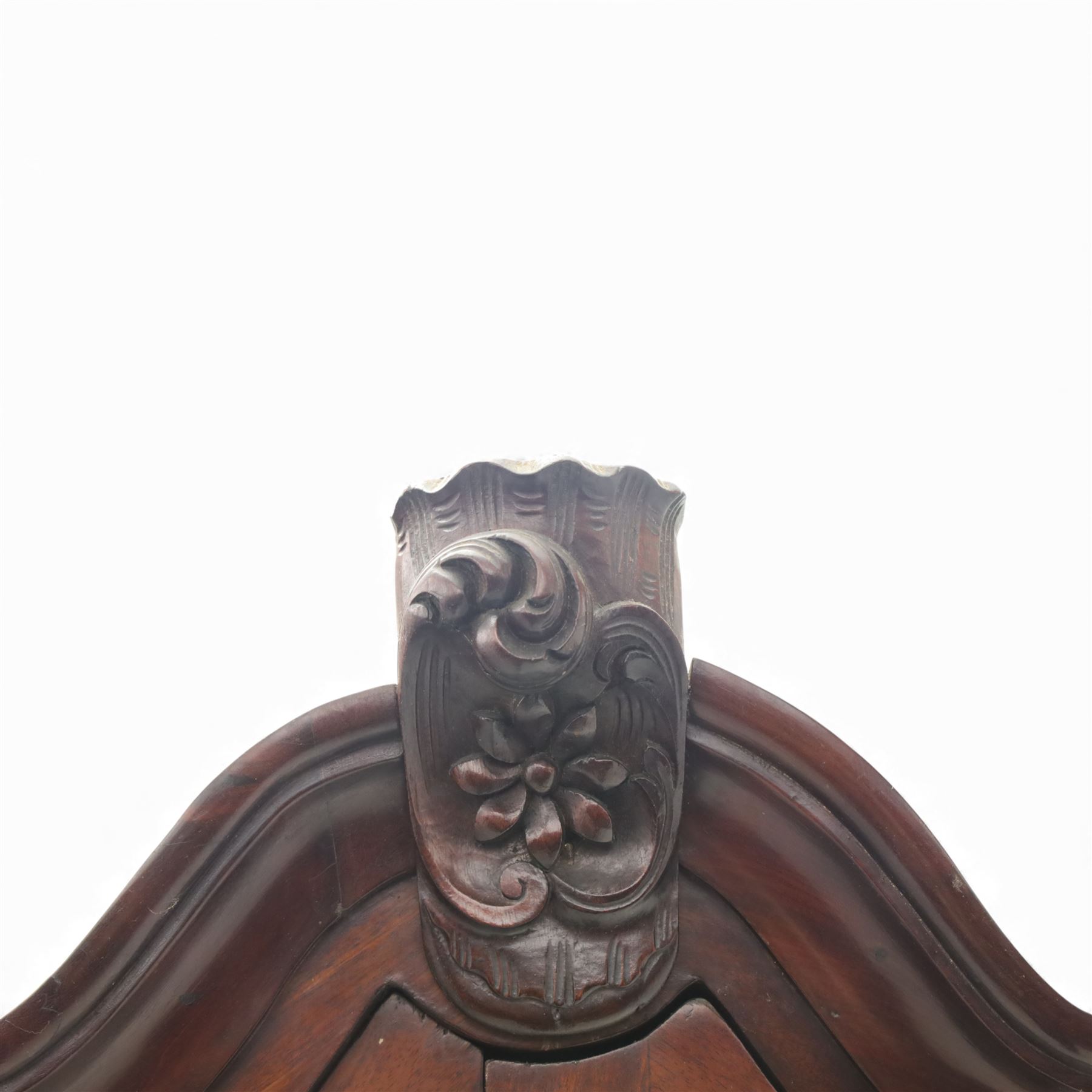 Late 19th century Continental bombe cabinet on chest, shaped moulded cornice with carved cresting, the upper section enclosed by a pair of arched glazed doors with astragal glazing revealing a shelved interior, the lower section fitted with four graduating drawers with rococo-style metal handles, serpentine front and sides, raised on scroll and paw feet