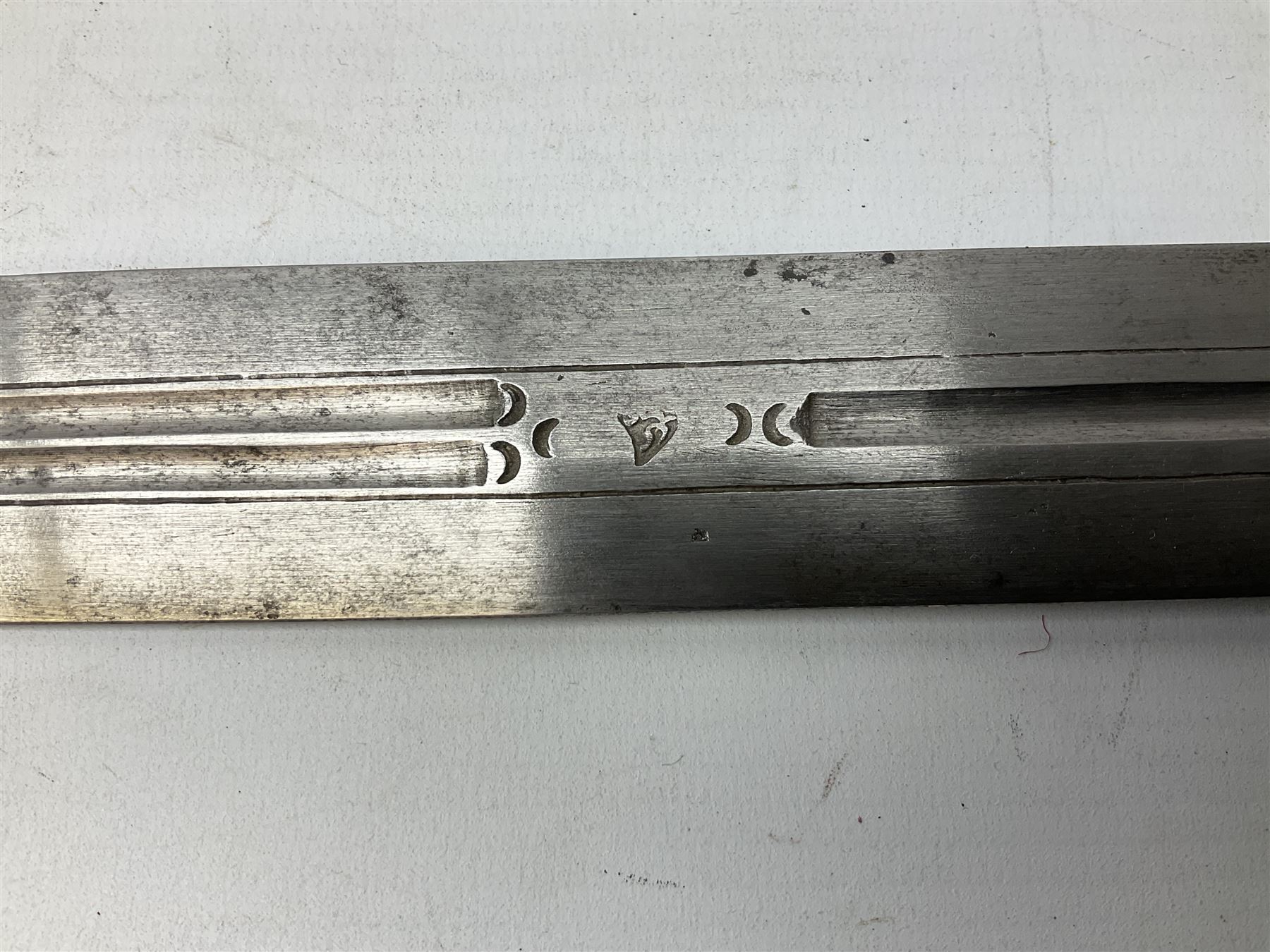 19th century Khanjali dagger, 33.5 cm double edged fullered blade with stamped makers marks, ornate cast grip, with engraved white metal scabbard, 46cm overall