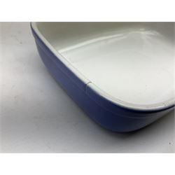 Emile Henry covered casserole dish of oval form in two tone brown and cream, no. 03.06, together with cast iron Nomar twin handled lidded casserole dish of oval form in navy, and other ovenware including Flintware ICTC, largest L35cm