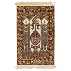 Indian silk-inlaid prayer rug, ivory field decorated with a triple-arched Mirab motif, pen...