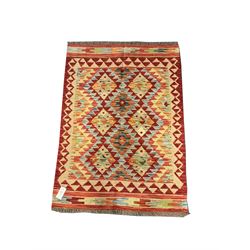 Choli Kilim red and beige ground rug, geometric patterned field