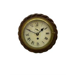 Edwardian - 8-day ships bulkhead clock and an Aneroid barometer.
In matching circular oak cases with carved rope twist bezels.
Clock with a painted metal dial, Roman numerals, minute track and steel spade hands, small seconds hand and platform regulation. Case 9