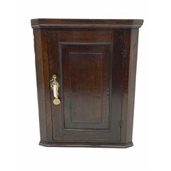 18th century oak corner cabinet enclosed by single fielded panel door