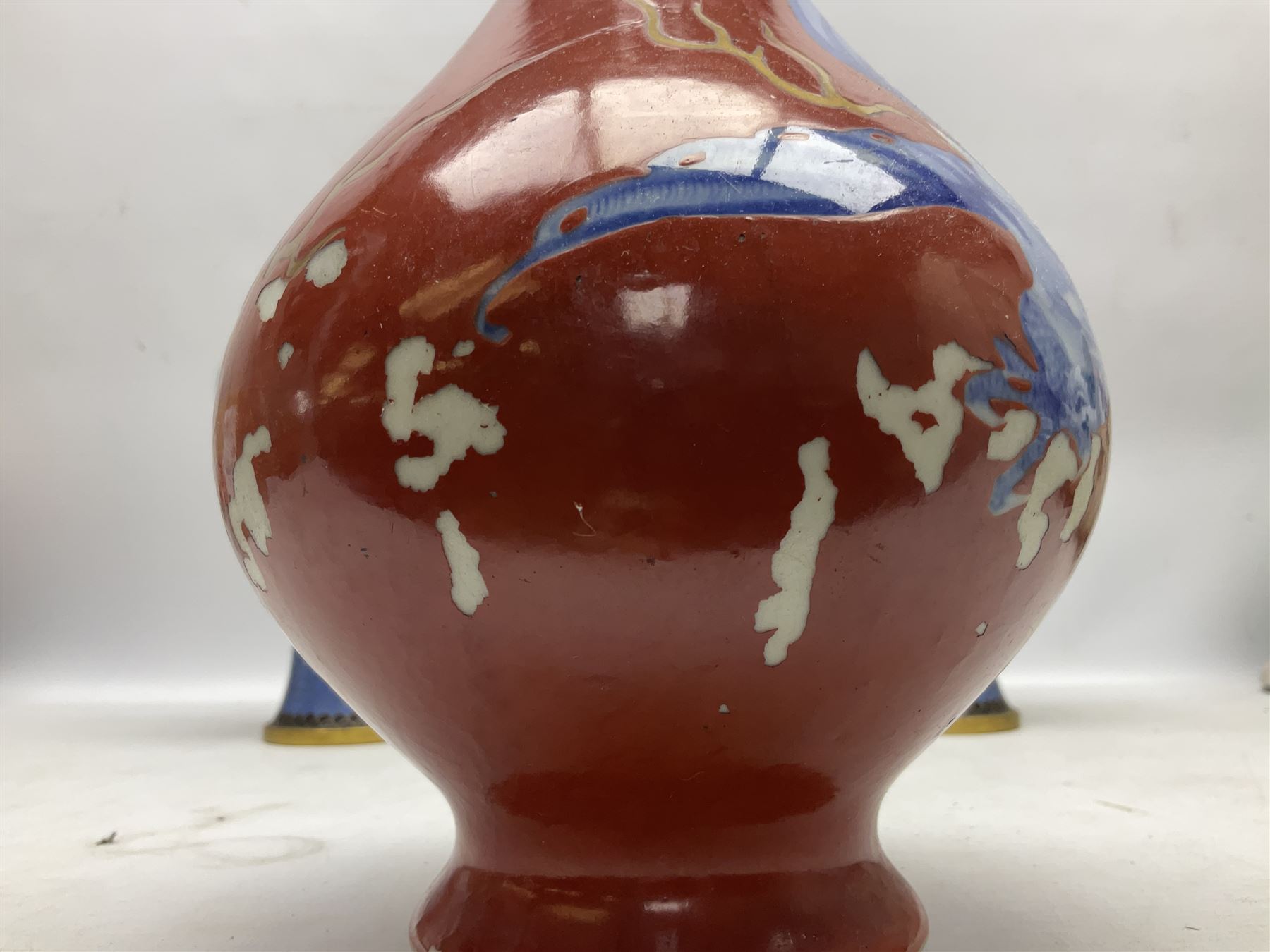 20th Century Japanese vase decorated with a blue dragon and gilding upon red yellow ground, bears Fukagawa Seiji mark (a/f), together with pair of blue cloisonné vases of baluster form decorated with blossom, and pair of Japanese vases, tallest H26cm