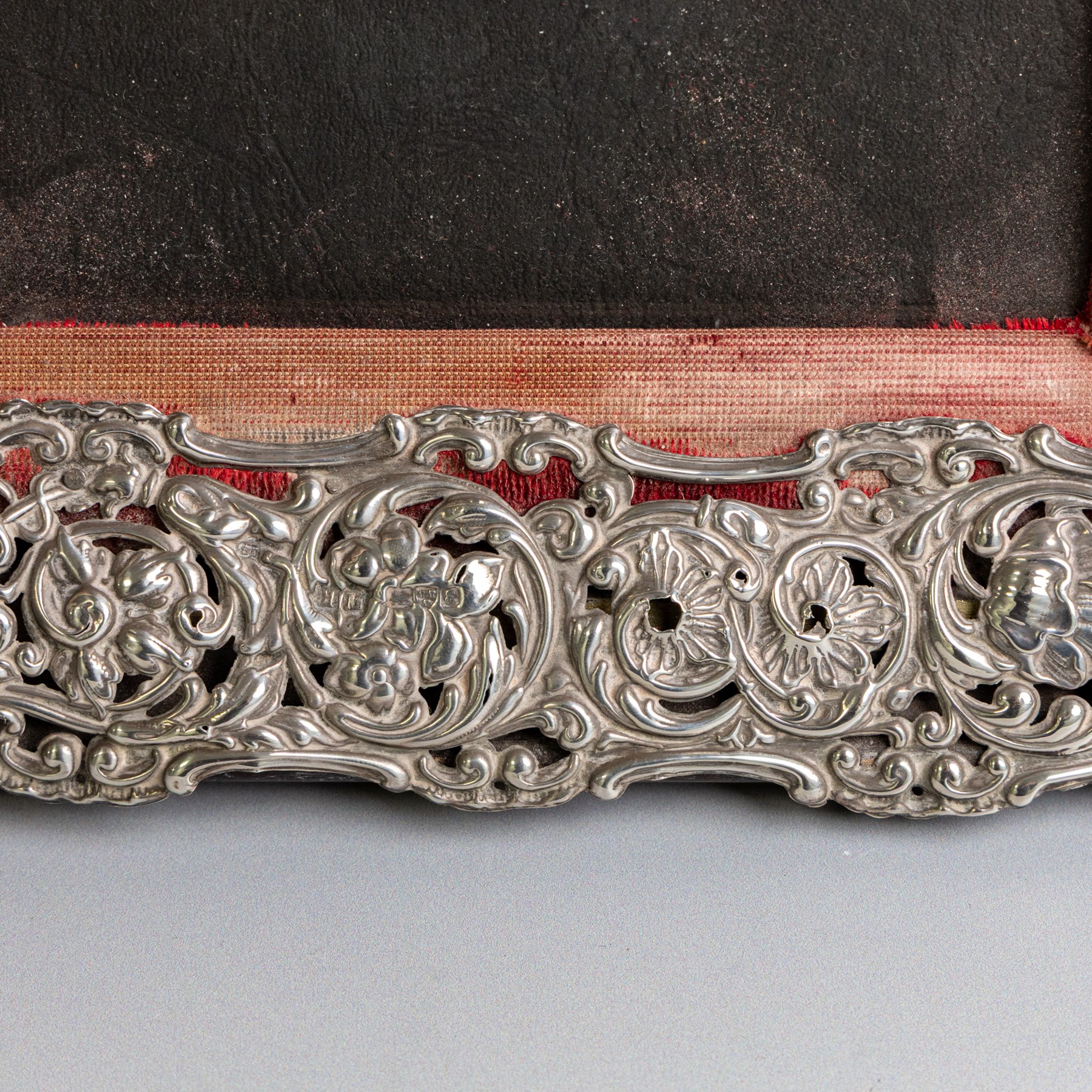 Edwardian silver mounted photograph frame, of rectangular form embossed with scrolling floral and foliate decoration, with easel support verso, hallmarked Henry Matthews, Chester 1905, H37cm