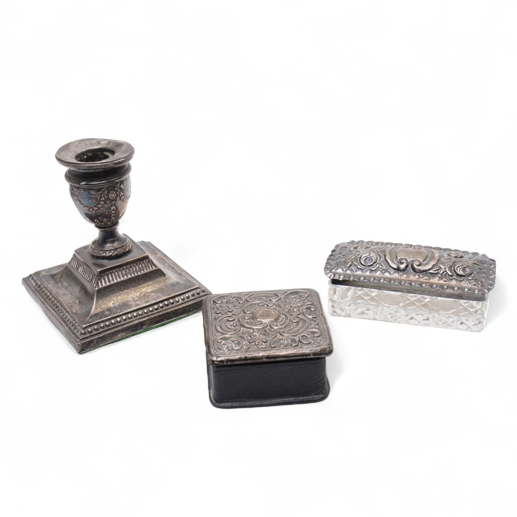 Various silver topped glass dressing table jars, scent flask and a silver dressing table candlestick 