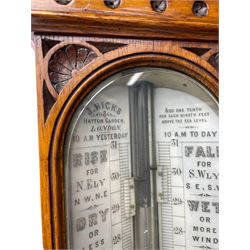J Hicks - Hatton Garden London, - late 19th century carved oak cased Fitzroy barometer in a richly carved case with a carved crested pediment and square cistern cover, inverted opaline register reflecting FitzRoy's predictions and a scale from 27 to 31 inches of barometric pressure, with a thick bore cistern tube and adjustable rack and pinion twin vernier, fitted with a glazed snail bulb mercury thermometer recording the air temperature in both Fahrenheit and Celsius. Mercury clean and present.
James Joseph Hicks was born in Ireland, however, early in his life he moved to London where he was apprenticed to the instrument maker Louis P Casella. In 1860 he went into business in his own right as a scientific instrument maker at 8 Hatton Gardens. In 1864 he was granted membership to the British Meteorological Society and exhibited instruments at the Royal Society Exhibitions between 1876 and 1913. Hicks was one of London's most prolific and eminent barometer makers. 