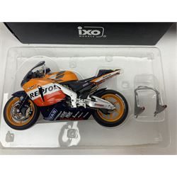 Three Ixo Models 1:12 scale die-cast models of motorcycles - BRB007 Honda NSR500 Michael Doohan 1998; BRB001 Honda RC211V Valentino Rossi 2003; and Yamaha YZR-M1 Colin Edwards MotoGP Phillip Island 2007; all boxed (3)