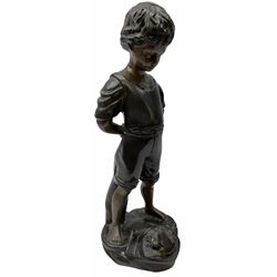 Bronze figure of a young boy standing pensively looking at a frog on a rock by his feet H39cm
