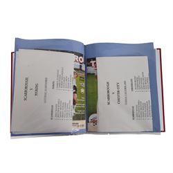 Comprehensive collection of approximately two hundred and twenty Scarborough FC football programmes for the 1999/00, 2000/01, 2001/02 and 2002/03 seasons, all filed within eight dedicated Scarborough FC red Home and Away binders
