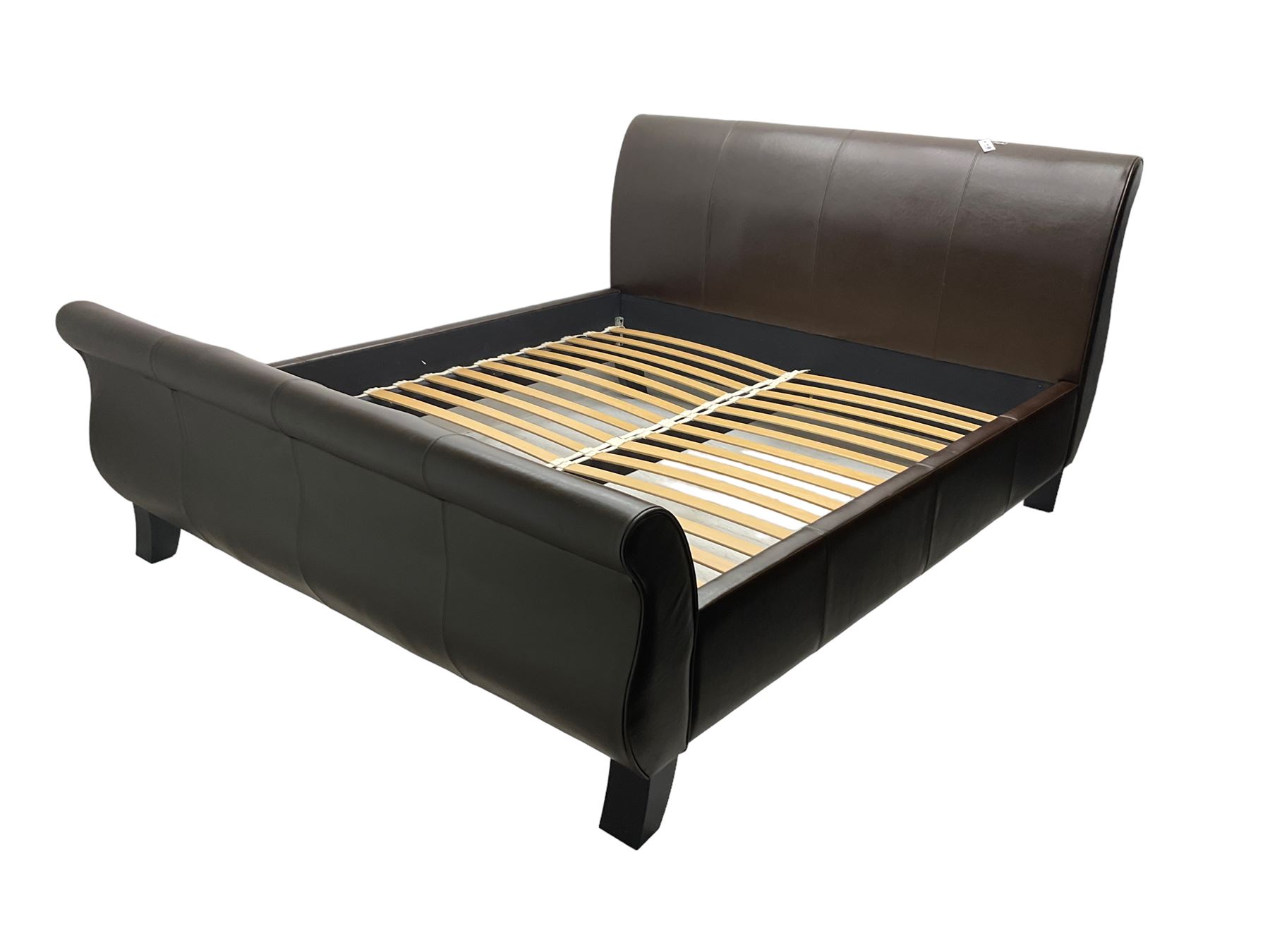 Super king 6' sleigh bed, upholstered in chocolate brown leather, with ebonised splayed feet