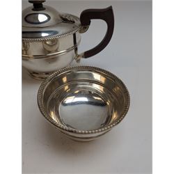 1930s silver three piece tea service, comprising teapot, milk jug and sugar bowl, each of circular form with oblique gadrooned rim, the teapot with Bakelite handle and finial, hallmarked Mappin & Webb Ltd, Birmingham 1931, teapot H14.5cm