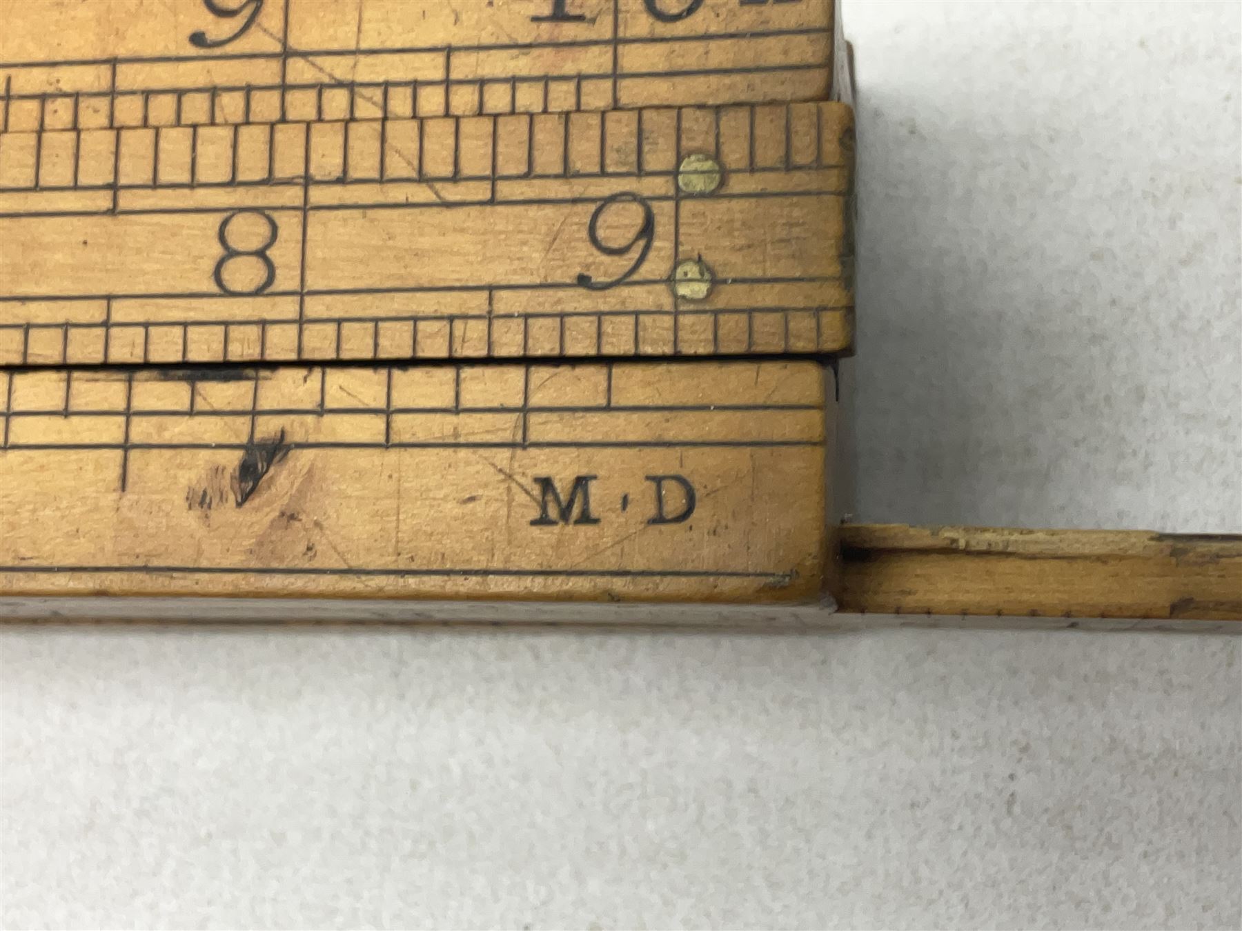 Late 18th/early 19th century boxwood ruler with four slides, for use by Customs &. Excise in the brewery trade; scales on all four sides each having a central slide with divisions on either side;  possibly made by 'E. Roberts, Dove Court, Old Jewry, London' (Edward Roberts (I) 1749-1776 & Edward Roberts (II) 1788-1795) L30.5cm