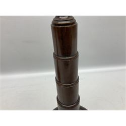 Pair of turned wooden candlesticks, the central column of stepped form raised upon circular spreading base, with drip trays, H56cm