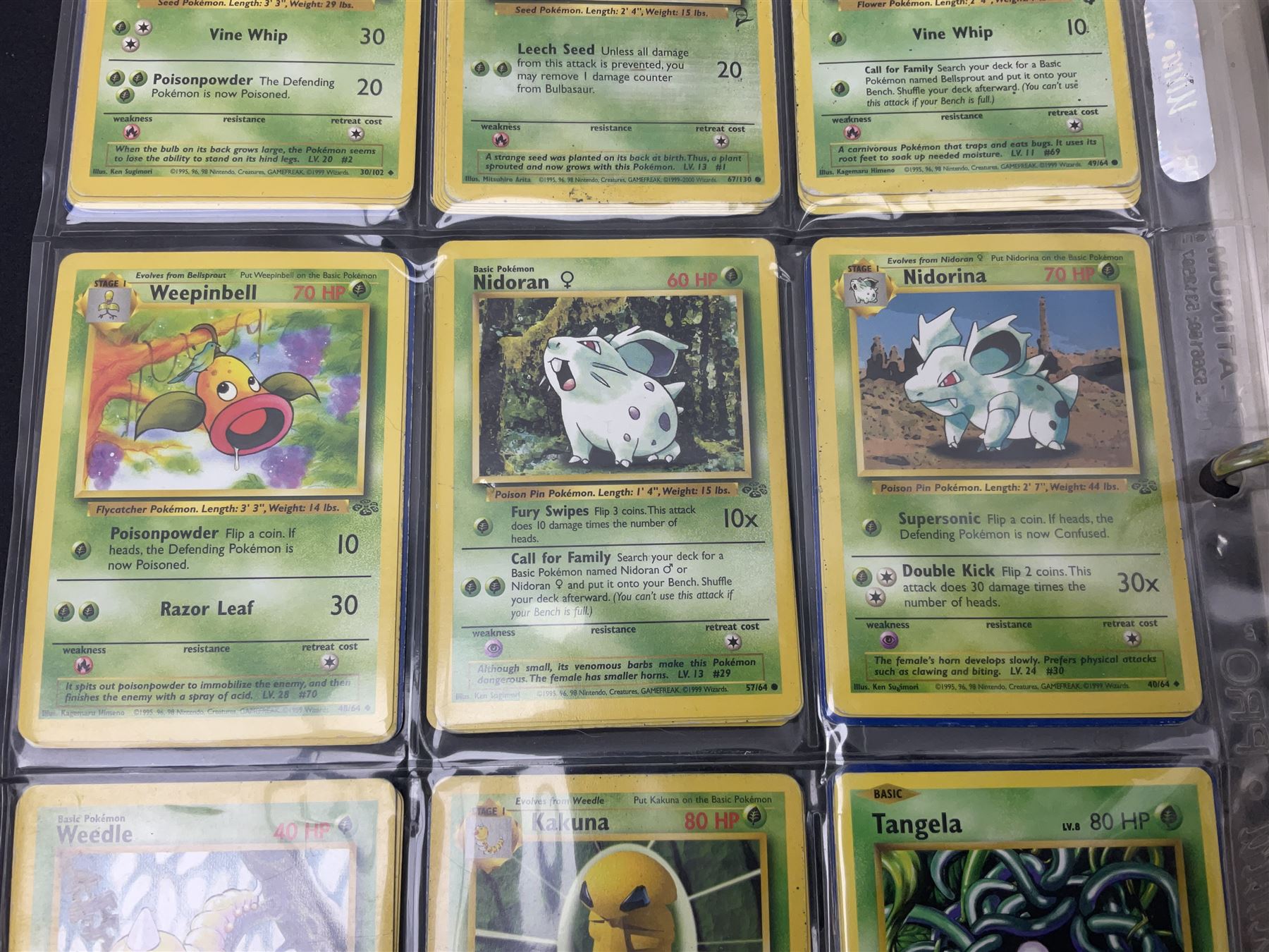 Collection of Pokemon trading cards, mostly 1999 Wizards Pokemon cards to include holo Charizard 4/102, first edition holo Machamp 8/102, further holographic cards; Dark Flareon 35/82 and Dark Vaporeon 45/82, cards from themed sets and 4th edition prints; 1998 Electronic Pokédex with cardboard boxes for themed decks Blackout, Overgrowth and Power Reserve Jungle, along with a large quantity of energy and trainer cards 