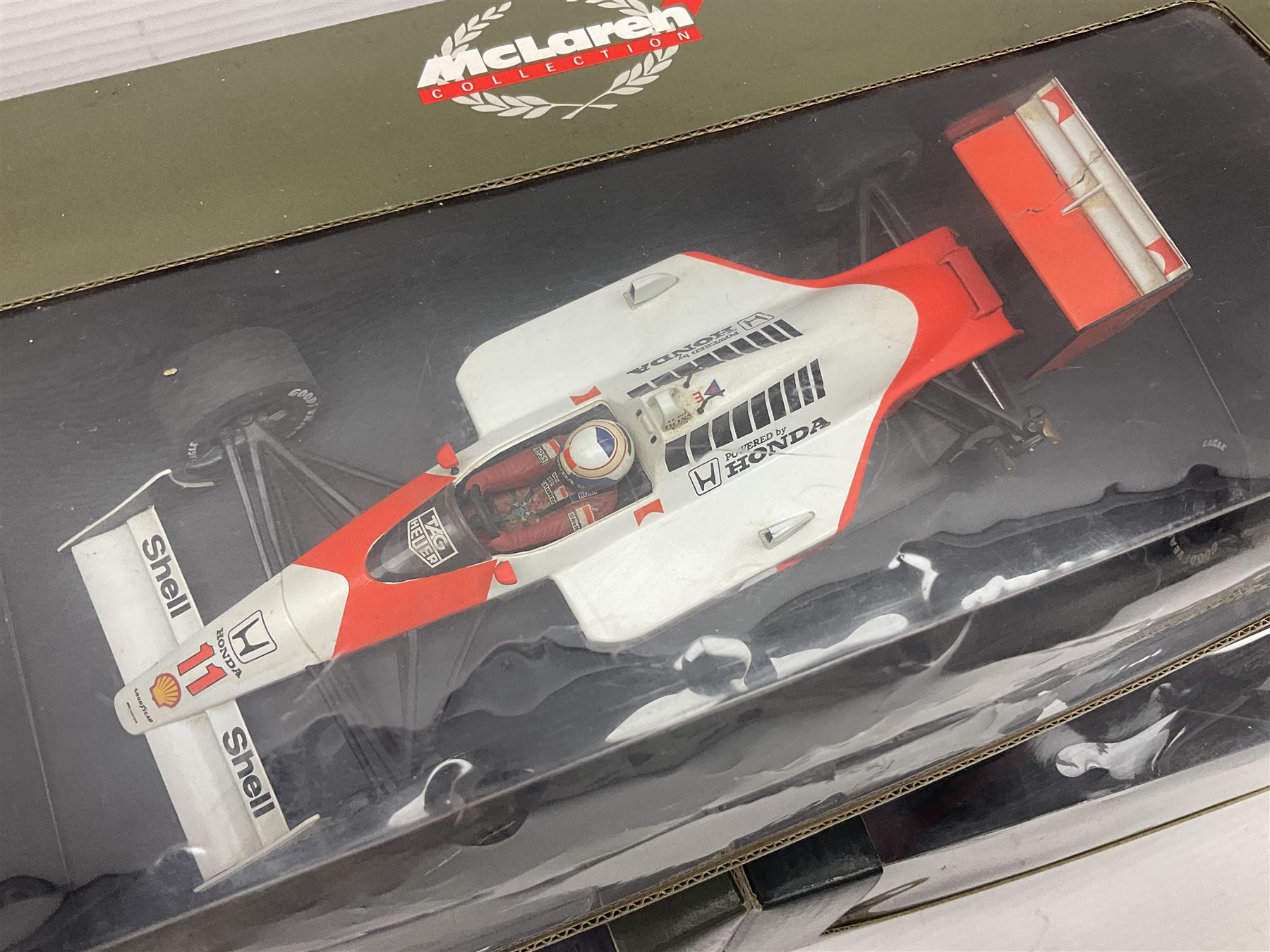 Three Paul's Model Art 1:18 scale die-cast McLaren racing cars - Mercedes MP4/11 D. Coulthard; MP4/4 A. Prost; and Mercedes MP4/10 M. Hakkinen; all boxed (3)