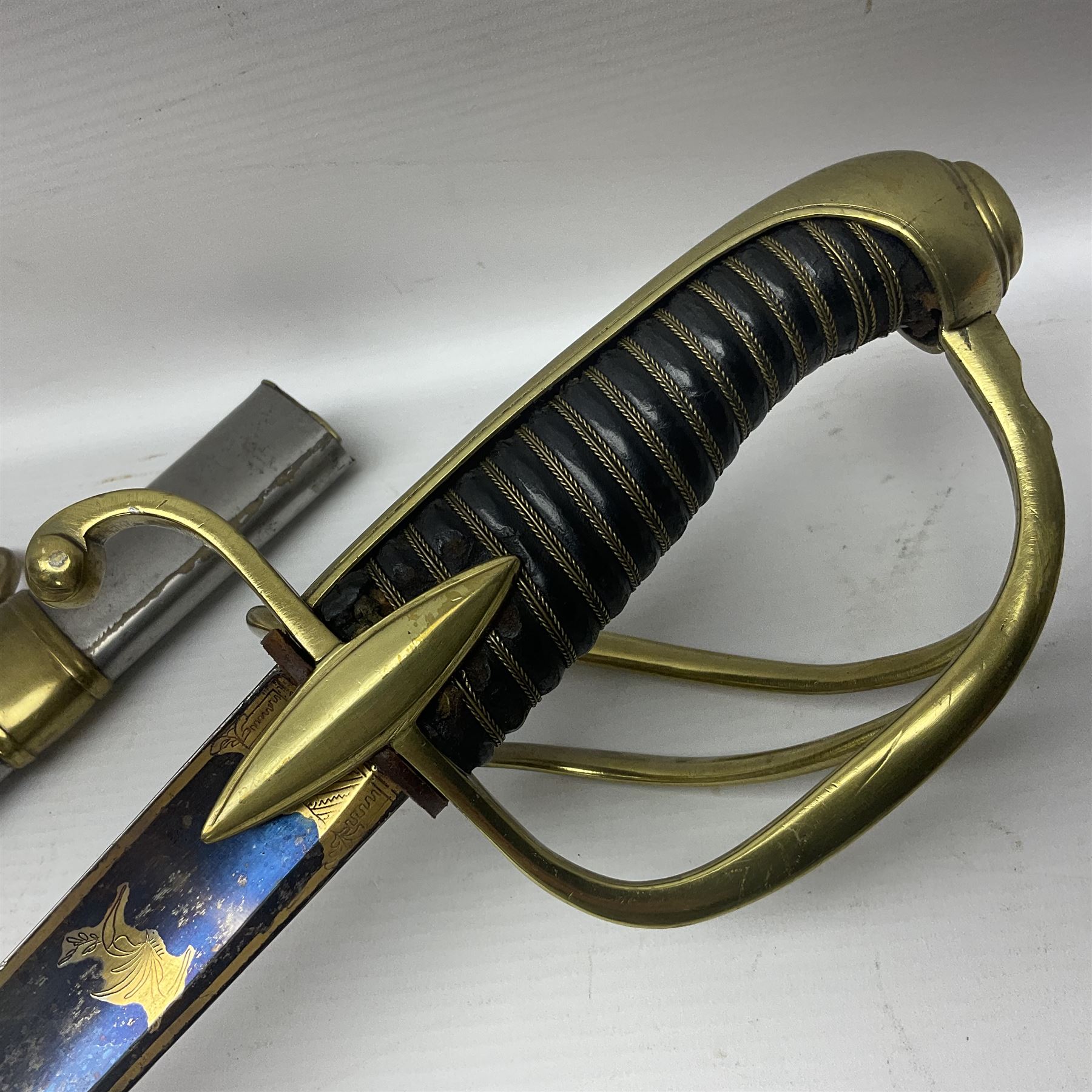 Early 19th century French Lancers officer's sword c1810, the 84cm curving fullered blade retaining most of its bluing, gilding and engraved decoration, inscribed I.S.& C. to ricasso (for Schimelbusch), brass three-bar hilt with elongated elliptical langets and wire-bound leather grip; in polished steel scabbard with two brass suspension rings L100cm overall