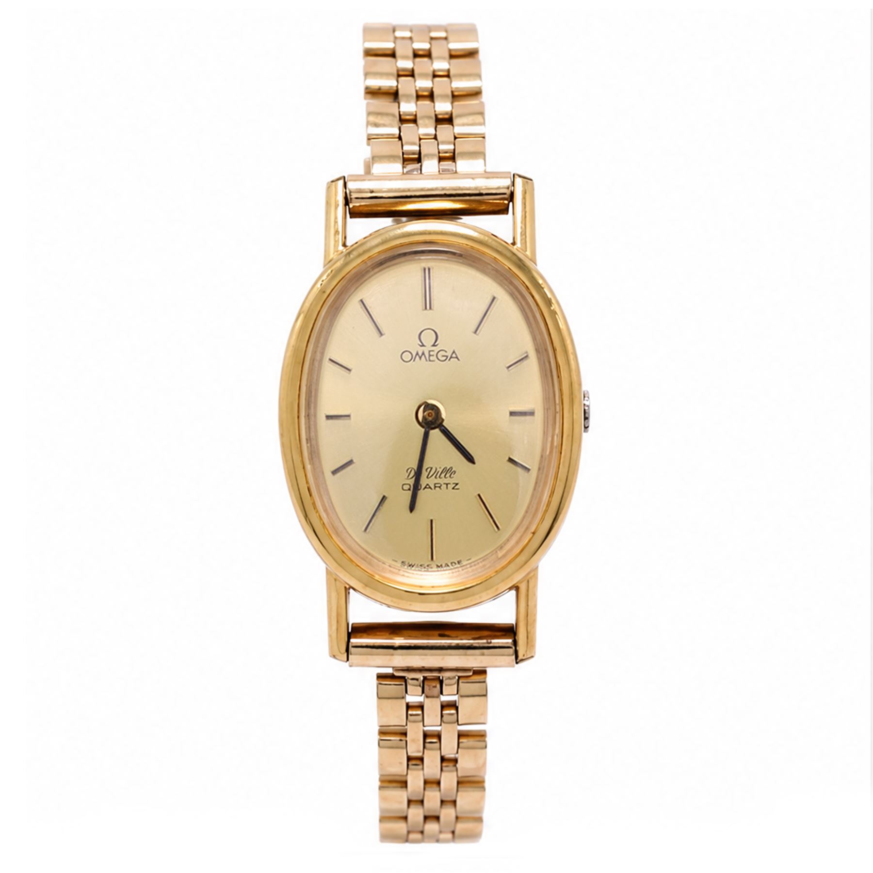 Omega ladies gold-plated quartz wristwatch, gilt dial with baton hour markers, on 9ct gold bracelet, Birmingham 1977, boxed with original leather strap