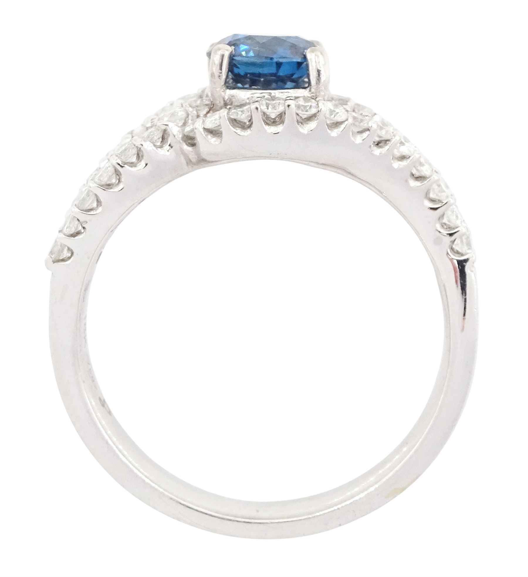 18ct white gold diamond crossover ring, the principal round brilliant cut fancy blue diamond of approx 0.75 carat, with round brilliant cut diamond surround and shoulders, stamped 750, total white diamond weight approx 0.60 carat