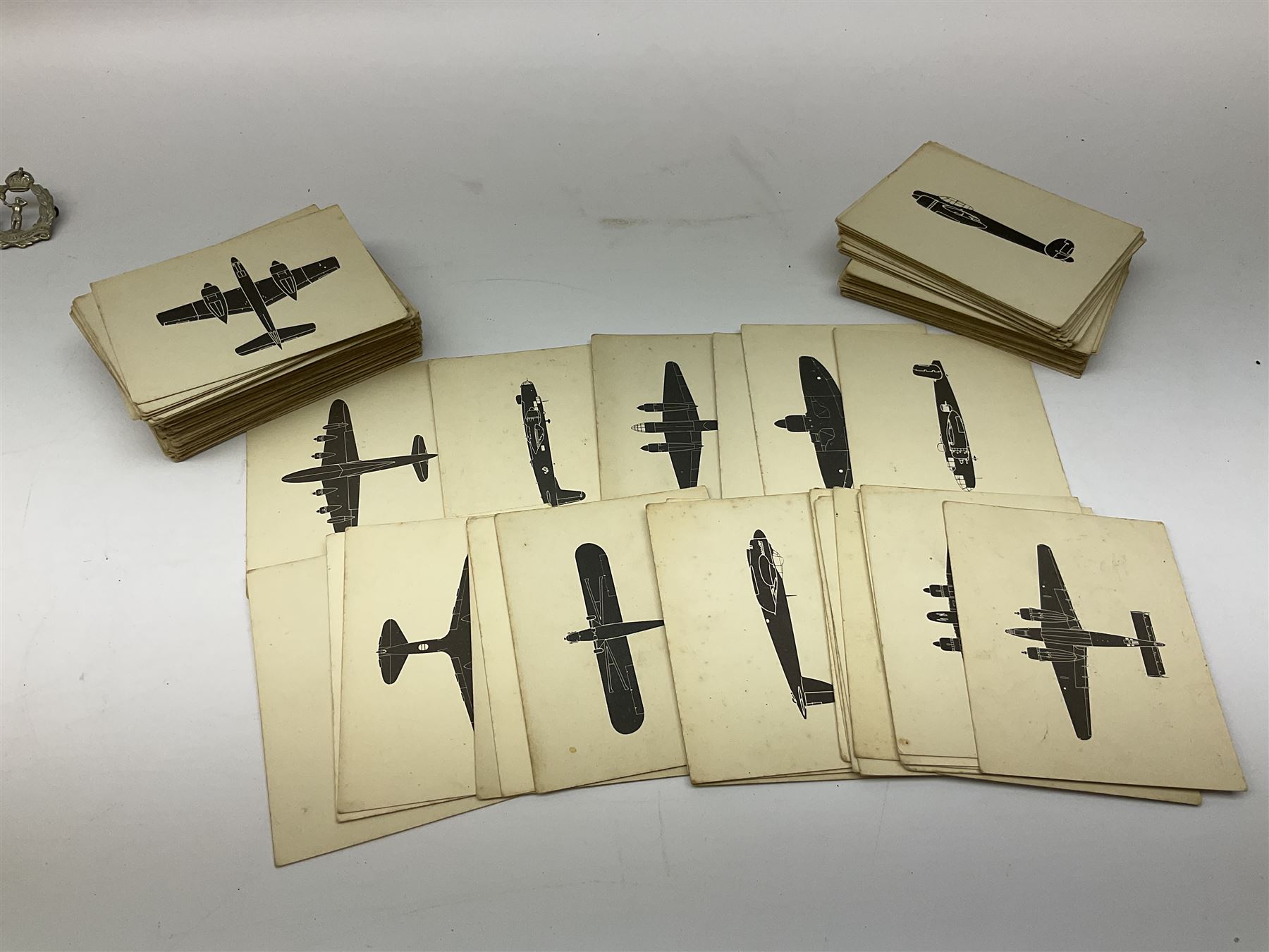 WW2 Royal Observer Corps - approximately one-hundred and seventy aircraft recognition cards; 1938 Instruction Booklet; cap badge and lapel badge; and cloth shoulder title