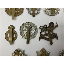 Twenty cap badges including Hertfordshire, Royal Sussex, Cambridgeshire, Hampshire, Notts and Derby, East Surrey, Herefordshire, South Lancashire, Devonshire, Bedfordshire, Durham Light Infantry etc (20)