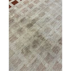 Contemporary camel ground woollen rug, decorated with gradient squares in shades of terracotta 
