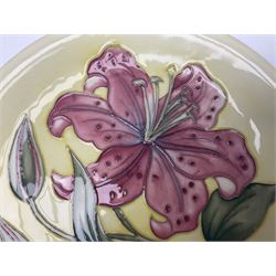 Moorcroft Tiger Lily pattern plate on a yellow ground, with painted and impressed mark beneath, D26cm